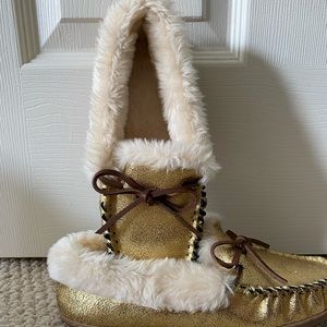 JCrew, Metallic gold faux suede and shearling moccasin slippers. 
Never worn.